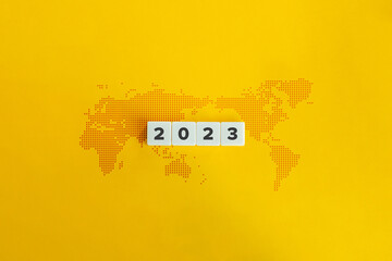 2023 Year and World Map Banner. Letter Tiles on Yellow Background. Minimal Aesthetics.