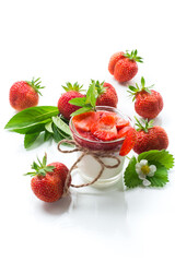 sweet homemade yogurt with strawberry jam and fresh strawberries in a glass cup