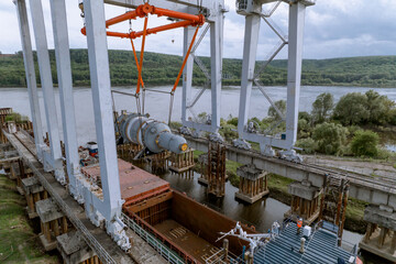 Unloading of the nuclear reactor at the port, moving the nuclear reactor from the ship to the...