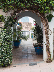 Arch-shaped old alley in the town of Estepona, Costa del Sol, Spain