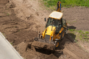 performing earthworks by a heavy machinery