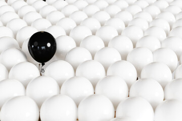 Outstanding Black Color balloon floating among White color balloon background. 3D Render. Selective focus.