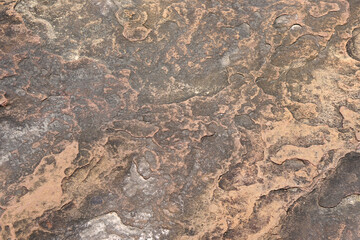 stone background was eroded by the wind creating a beautiful pattern. marble background with text