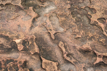 stone background was eroded by the wind creating a beautiful pattern. marble background with text