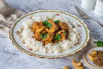 Chicken korma curry with cashew nuts and rice