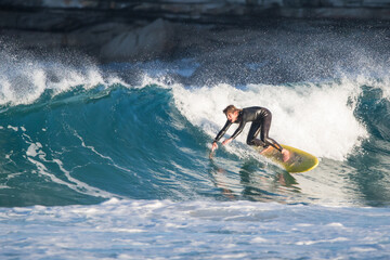 Surfing caucasian man wave water blue yellow board beach surf