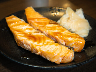 Grilled salmon steak with Japanese sweet sauce on a plate. - 508919455