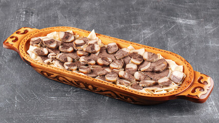 Kazakh national dish beshbarmak on gray background