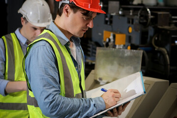 The engineer working and checking in production line in factory, technician or workers operate the machine in industry