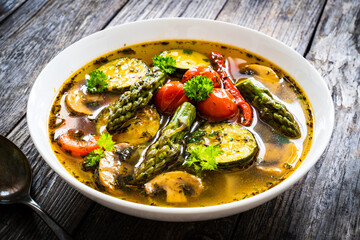 Asparagus soup on wooden table
