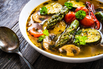 Asparagus soup on wooden table
