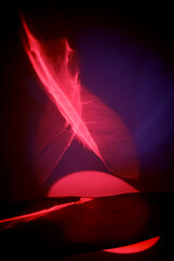 Reflection of red light in a liquid mirror, abstraction. Red fire, fire and love passion