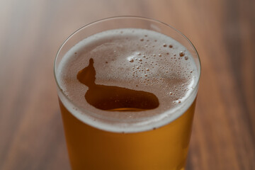 Organic apple cider in tumbler glass on wood table