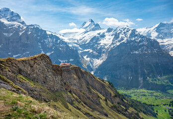 Landscape  of  sky cliff walk metal bridge at First peak above Grindelwald village.  Jungfrau...