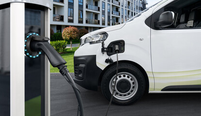 Electric vehicles charging station on a background of delivery van. Concept
