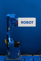 Robot arm with box and text ROBOT. Smart industry concept