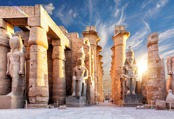Columns and statues of the Luxor temple main entrance, first pylon, Egypt - obrazy, fototapety, plakaty