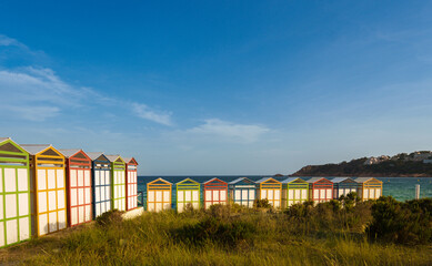 Fototapeta na wymiar Famous beach huts in Sagaro with Playa de Sant Pol, Costa Brava. Spain. Mediterranean Sea