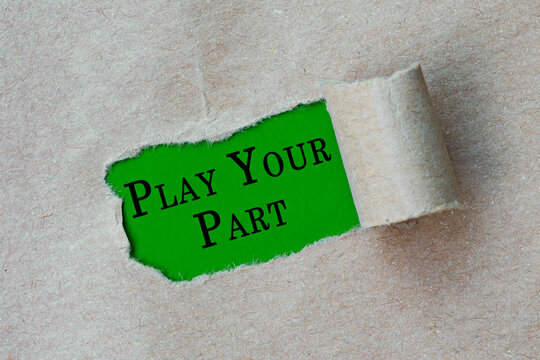 Play your part text on torn hole in the sheet of brown paper on green background