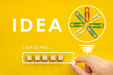 Lightbulb with download bar or loading idea business concept and progress. Yellow background