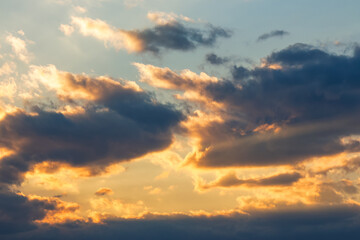 Naklejka na ściany i meble dramatic sky at sunset. beautiful cloud formations in evening light