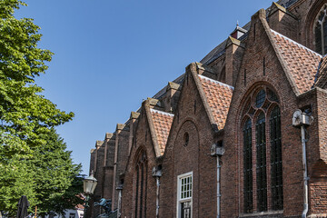 Fototapeta na wymiar St. George’s Church (Sint Joriskerk, 1200 - 1375-1450) at the Garden square (De hof) in the medieval center of the Dutch historic city of Amersfoort. the Netherlands.