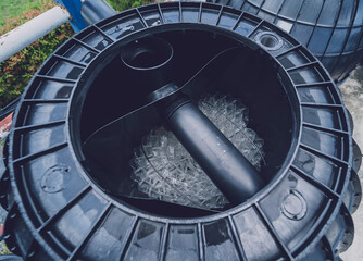 black plastic water storage tanks at the manufacturer factory depot