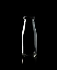 Empty bottle isolated on black background