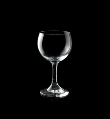 Empty wine glass isolated on black background