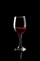 Red wine glass isolated on black background