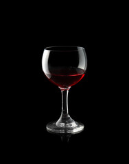 Red wine glass isolated on black background