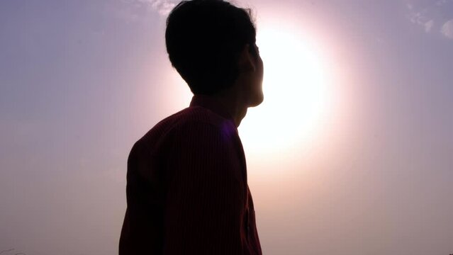 silhouette of a person in the sun
