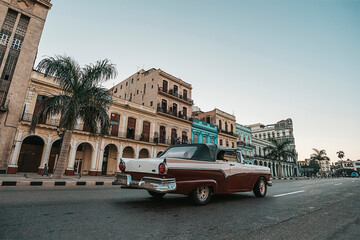 Street scene with historic buildings, people walking, and retro car, architecture, Paseo di Marti, Prado, Habana Vieja, Havana,