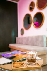 coffee in beauty cosmetic salon. Focus on coffee cup. lounge zone background