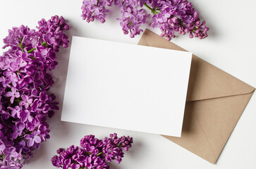 Invitation or greeting card mockup with spring lilac flowers