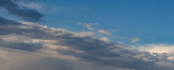 Obraz premium Rain clouds against the blue sky.
