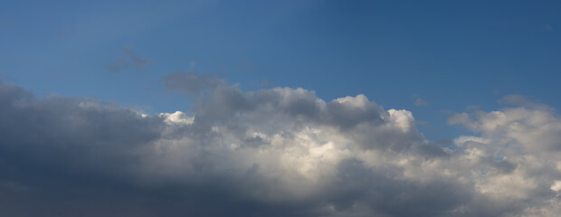 Obraz premium Rain clouds against the blue sky.