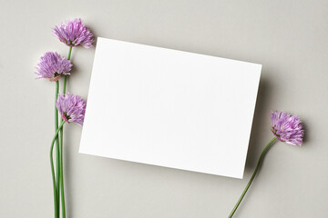 Blank invitation or greeting card mockup with flowers
