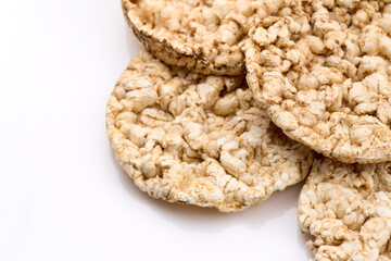 Puffed rice bread isolated on white background. Rice cakes. Round diet crispbreads on a white background. Round shaped cereal bread, healthy food without yeast. 