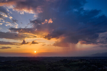 Scenic sunset over the vineyard in Tuscan hills