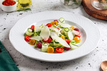 Plate of gourmet fresh vegetable salad on served table