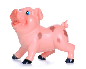 Obraz na płótnie Canvas toy figure pig on white background isolation