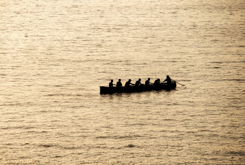 rowers in trawler training in the sea