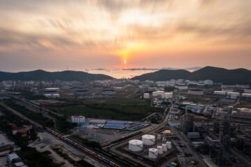 Aerial view of Oil and gas industry - refinery, and Petrochemical plant on island at evening sunset background