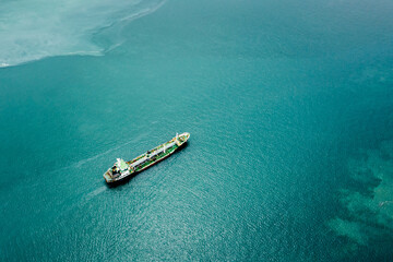 oil and gas LPG. container tank ship sailing in green sea. transportation concept. aerial view