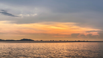 The red clouds at sunset look beautiful in the evening. ocean landscape