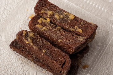Container with delicious rye croutons and garlic. Snack for beer. Close-up