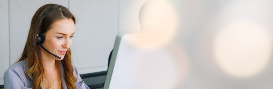 Business people wearing headset working in office in widen view to support remote customer or colleague. Call center, telemarketing, customer support agent provide service on telephone video call.