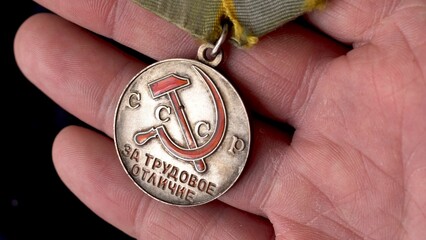 USSR medal. remuneration for work. human victory. labor difference. Rewarding. close-up.