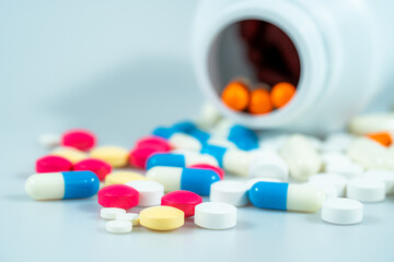 Macro shot of various colored pills on a white background, close-up health care and medical concept